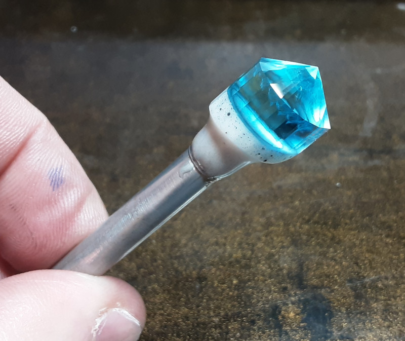 Precision faceted natural blue topaz gemstone